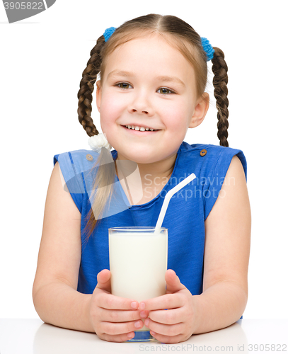 Image of Cute little girl with a glass of milk