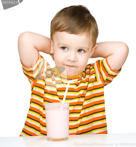 Image of Cute little boy with a glass of milk