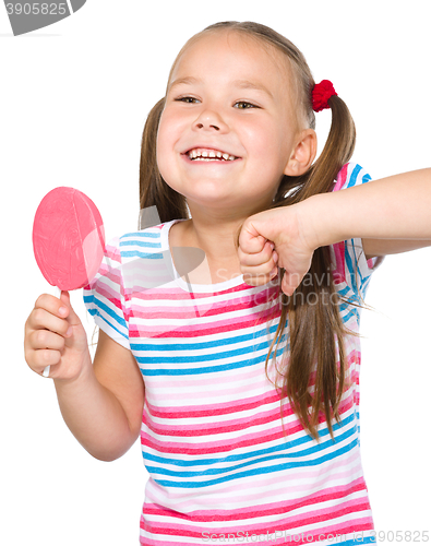 Image of Little girl with lollipop