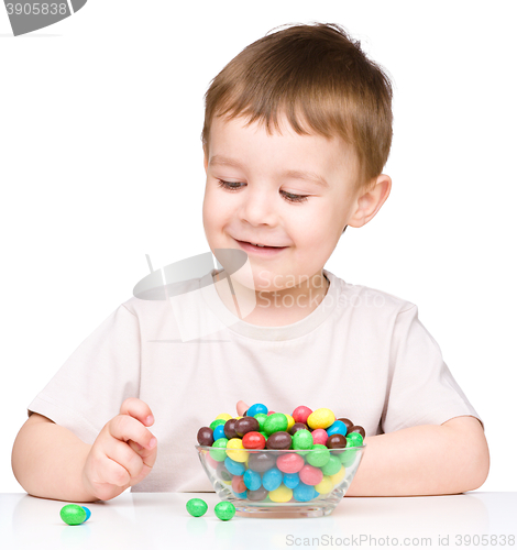 Image of Portrait of a boy with candies