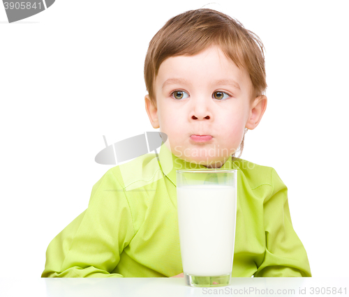 Image of Cute little boy with a glass of milk