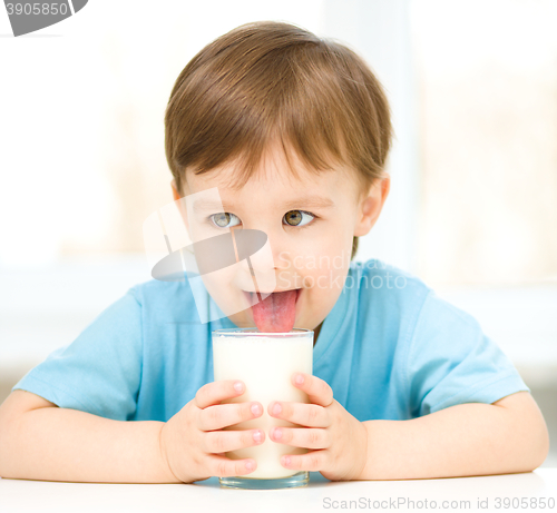 Image of Cute little boy with a glass of milk