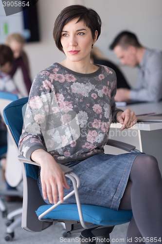 Image of portrait of young business woman at office with team on meeting 