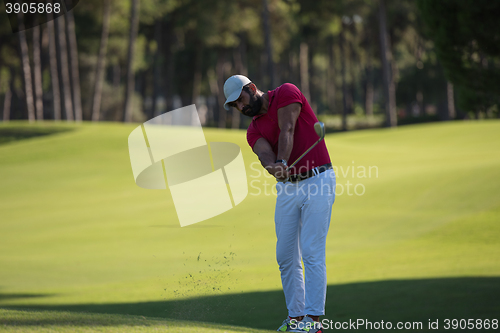 Image of golf player hitting long shot