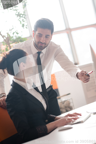 Image of business couple working together on project