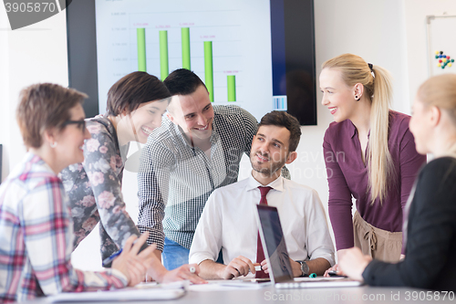 Image of young business people group on meeting at modern office