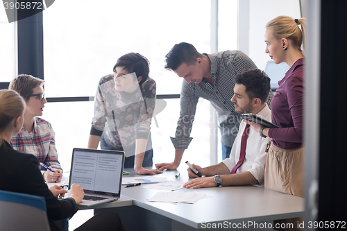 Image of young business people group on meeting at modern office