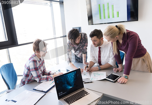 Image of young business people group on meeting at modern office