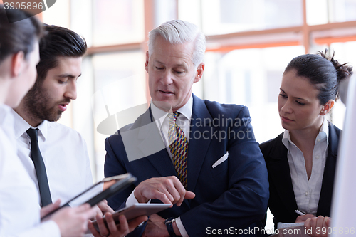 Image of young startup businessman making presentation to senior investio