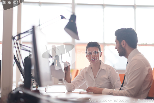 Image of business couple working together on project