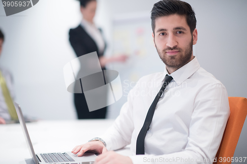 Image of young business man at meeting