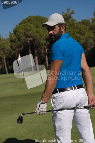 Image of golf player portrait from back