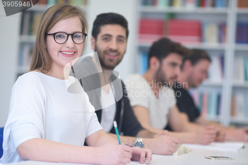 Image of group of students study together in classroom