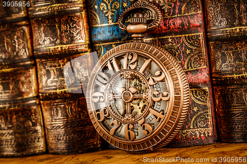 Image of Old Books and Vintage pocket watch