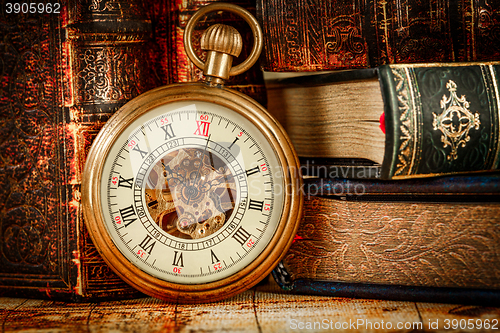 Image of Old Books and Vintage pocket watch