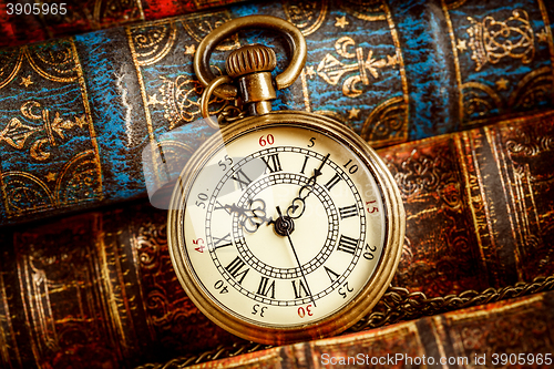 Image of Old Books and Vintage pocket watch