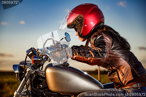 Image of Biker girl on a motorcycle