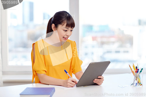 Image of asian woman student with tablet pc at home