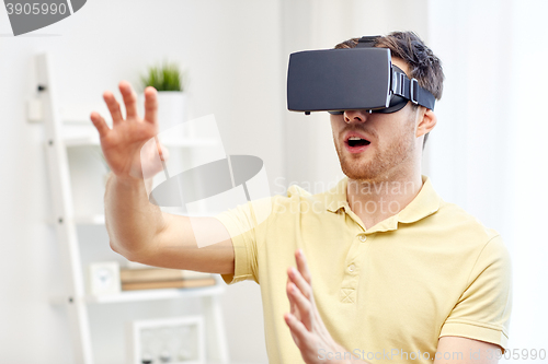 Image of young man in virtual reality headset or 3d glasses