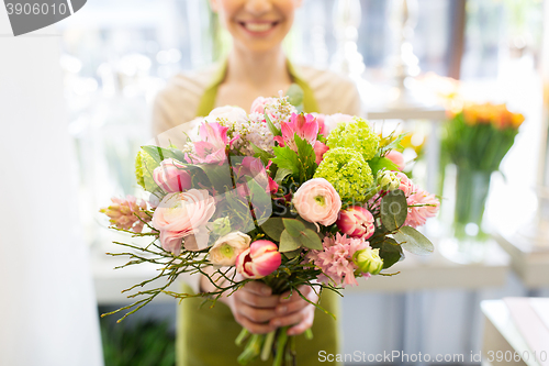 Image of close up of woman holding bunch at flower shop