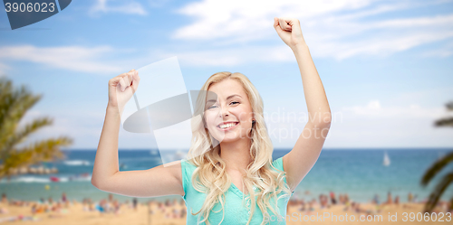 Image of happy young woman or teen girl celebrating victory