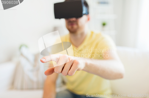 Image of young man in virtual reality headset or 3d glasses