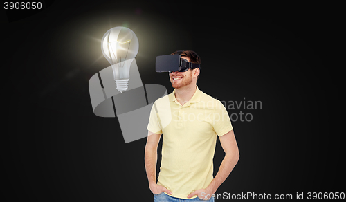 Image of happy man in virtual reality headset or 3d glasses