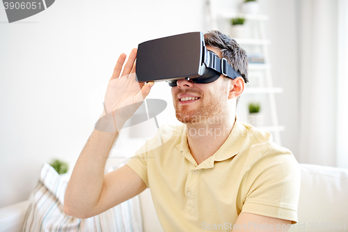 Image of young man in virtual reality headset or 3d glasses