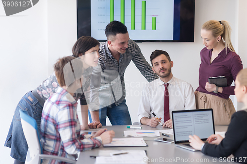 Image of young business people group on meeting at modern office