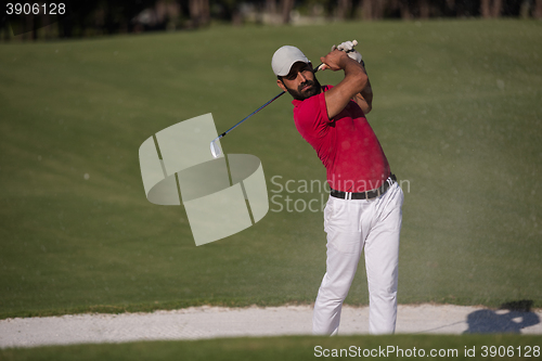 Image of golfer hitting a sand bunker shot