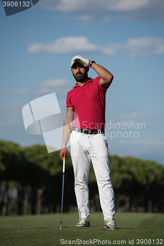 Image of handsome middle eastern golf player portrait at course