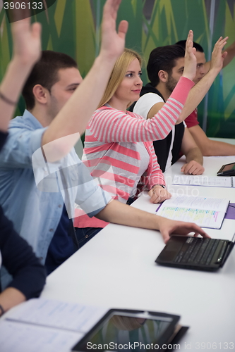 Image of students group raise hands up