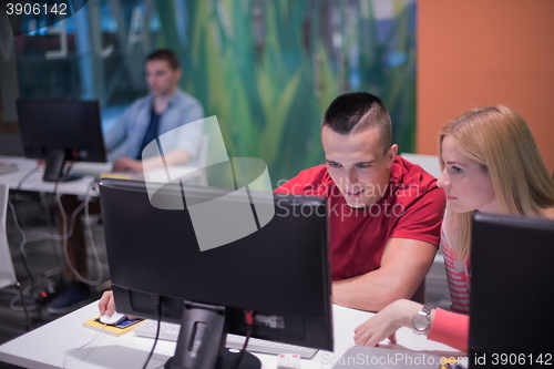 Image of technology students group in computer lab school  classroom