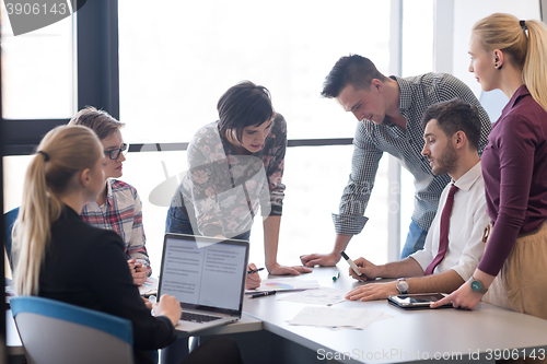 Image of young business people group on meeting at modern office