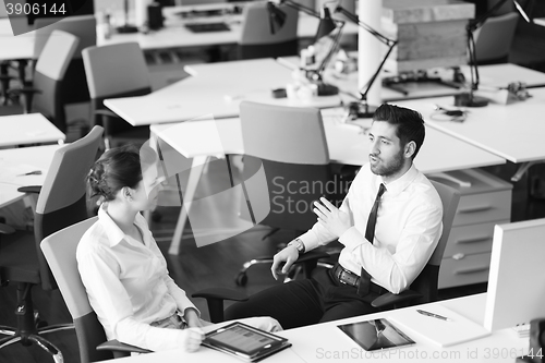 Image of business couple working together on project