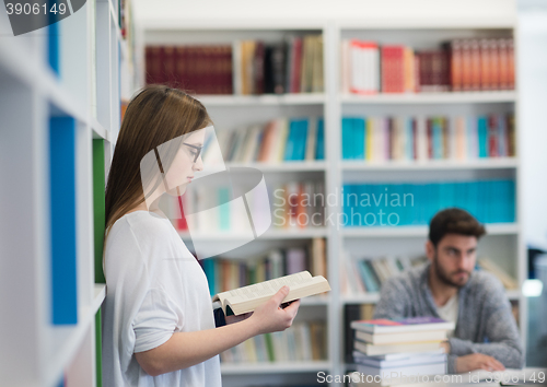 Image of students couple  in school  library