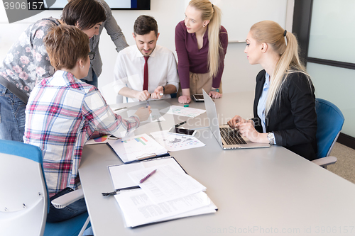 Image of young business people group on meeting at modern office