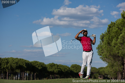 Image of golf player hitting long shot