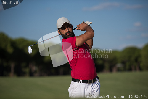 Image of golfer hitting a sand bunker shot