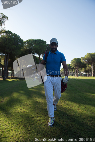Image of golf player walking