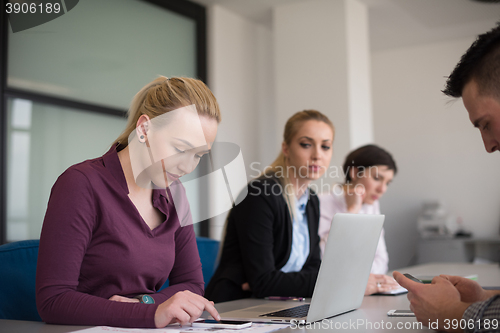 Image of young business people group on team meeting at modern office