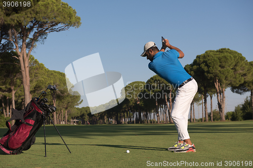 Image of golf player hitting shot