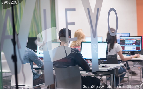 Image of technology students group working  in computer lab school  class