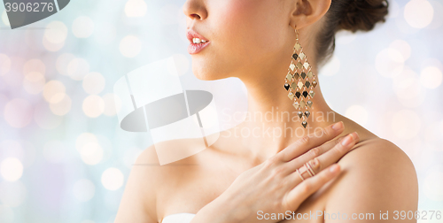 Image of close up of beautiful woman with earrings