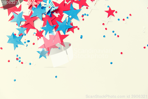 Image of stars confetti on american independence day party