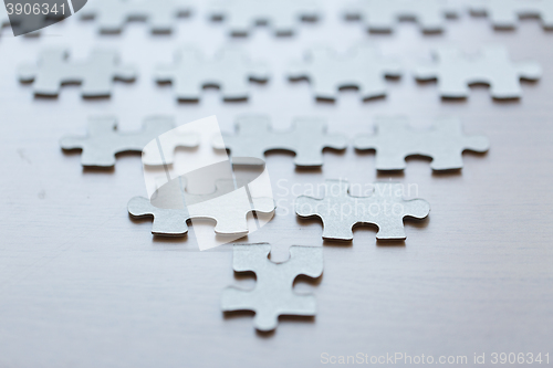 Image of close up of puzzle pieces on table