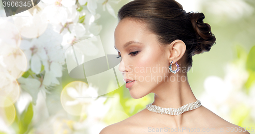 Image of close up of beautiful woman face with earring