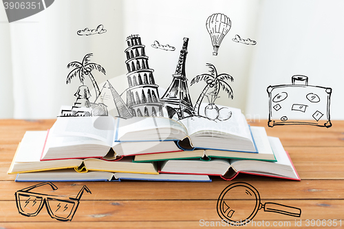 Image of close up of books on table with landmarks doodles