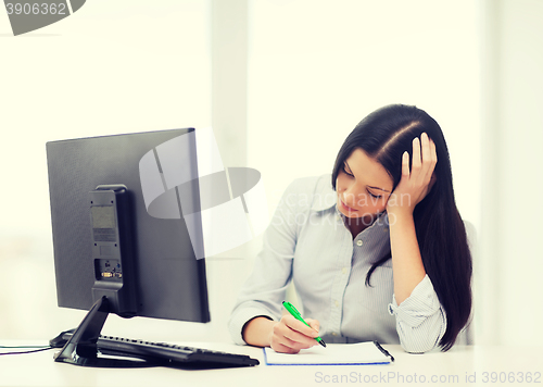 Image of tired businesswoman or student