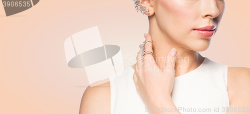 Image of close up of beautiful woman with ring and earring